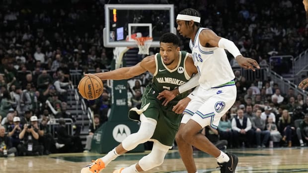 Feb 8, 2024; Milwaukee, Wisconsin, USA; Milwaukee Bucks forward Giannis Antetokounmpo (34) drives for the basket against Minnesota Timberwolves forward Jaden McDaniels (3) during the third quarter at Fiserv Forum.